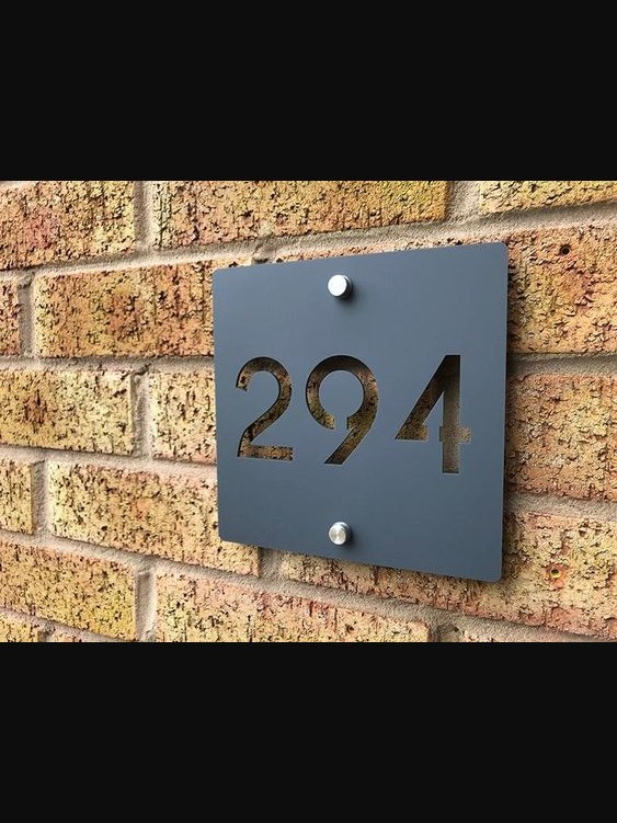 Unit number plate set on brick
