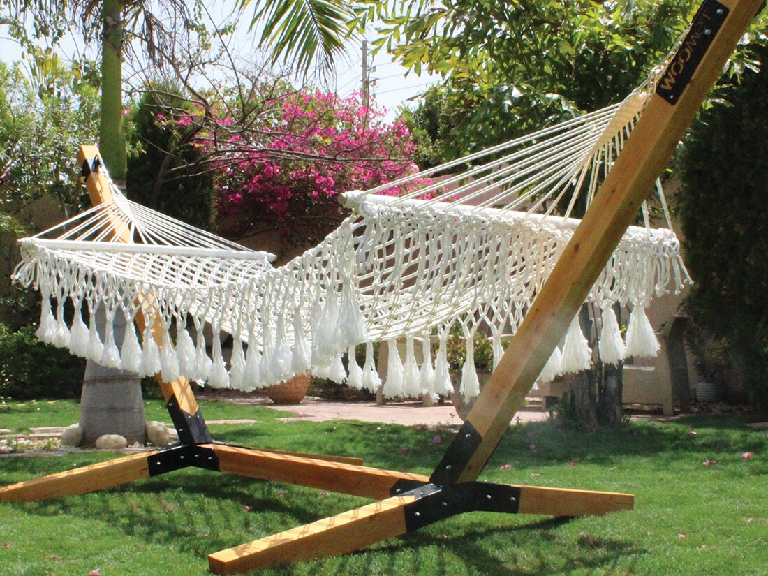 WOOMET hammock with timber frame installed in a garden