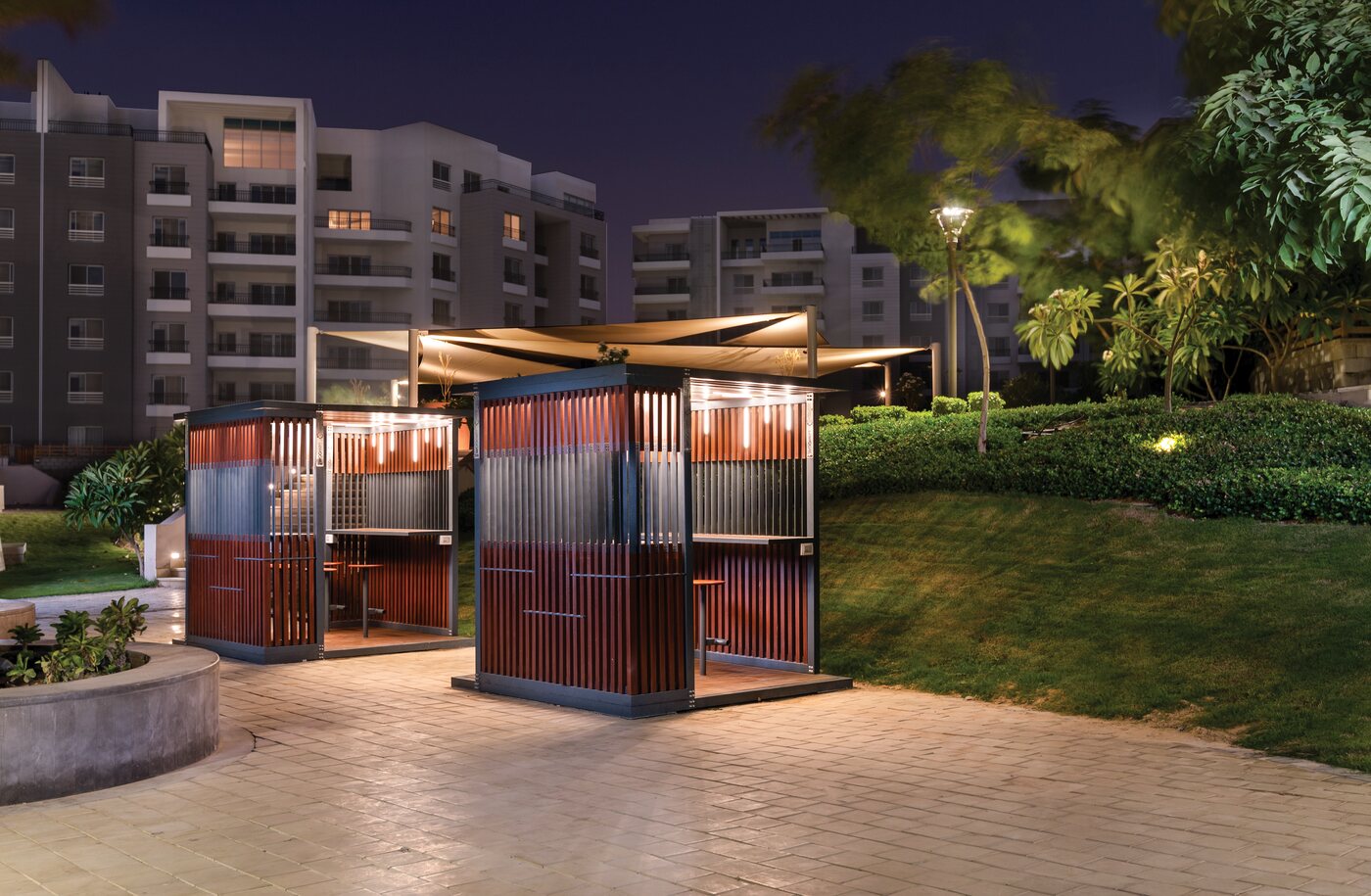 WOOMET shaded-seating pavilions installed at the Cairo Festival City compound, at night